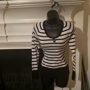 Stripped Puma sweater . Front is black and white back includes color